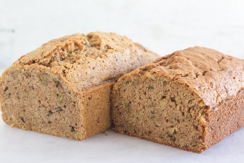loaves of low FODMAP & Gluten-free Zucchini bread on a white surface