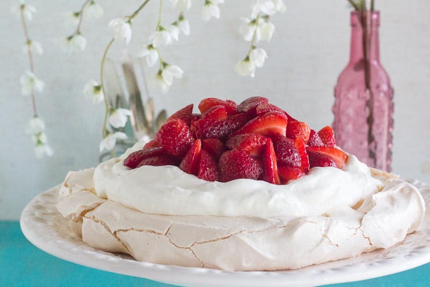 low FODMAP strawberry pavlova on white plate