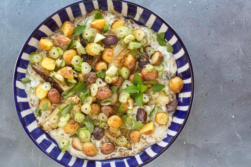 overhead image of Potato & Fennel Salad with Cucumber Yogurt Raita on blue and white plate