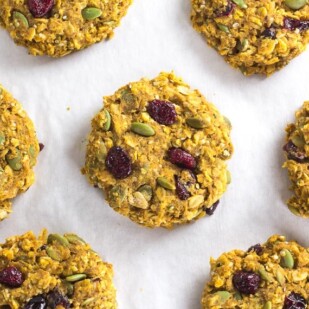 Low FODMAP Pumpkin Cranberry Oat Breakfast Cookies on pan lined with parchment paper