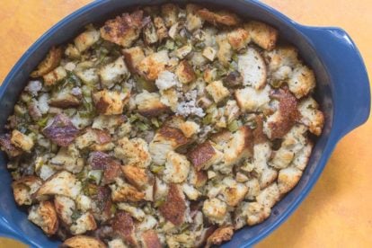 Low FODMAP Sourdough Apple Stuffing with Sausage in blue casserole dish