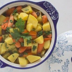 Overhead image of carrot % potato tsimmes in blue and white bowl-2