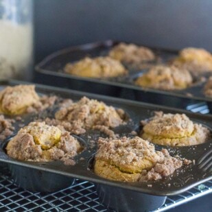 low FODMAP dairy free gluten free pumpkin streusel muffins in pans on cooling racks