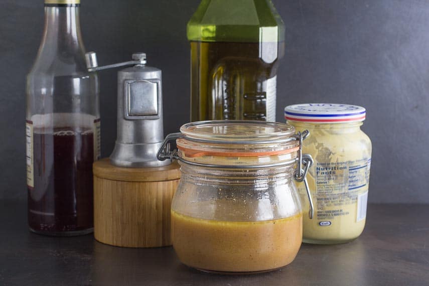 red wine vinaigrette ingredients against dark background