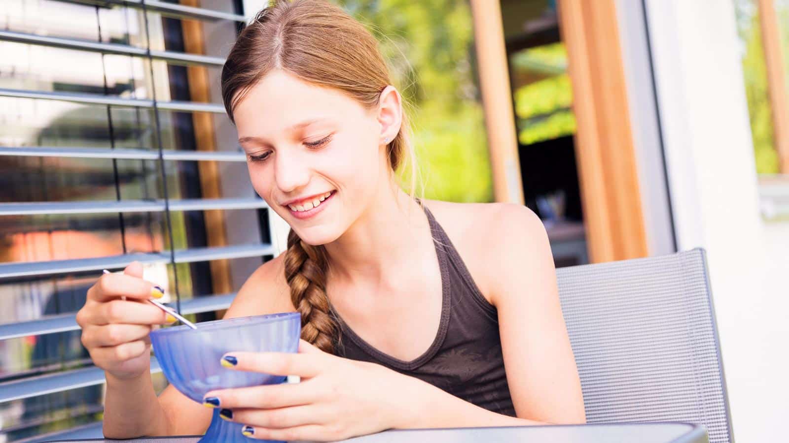 teen eating ice cream. nullplus via 123rf