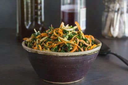 Low FODMAP Kale, Carrot & Apple Salad in a ceramic bowl