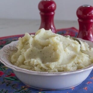 Low FODMAP Vegan Garlic Mashed Potatoes with salt and pepper shakers