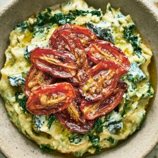 Spinach and Blue Cheese Polenta with Slow-Roasted Tomatoes in a rustic bowl