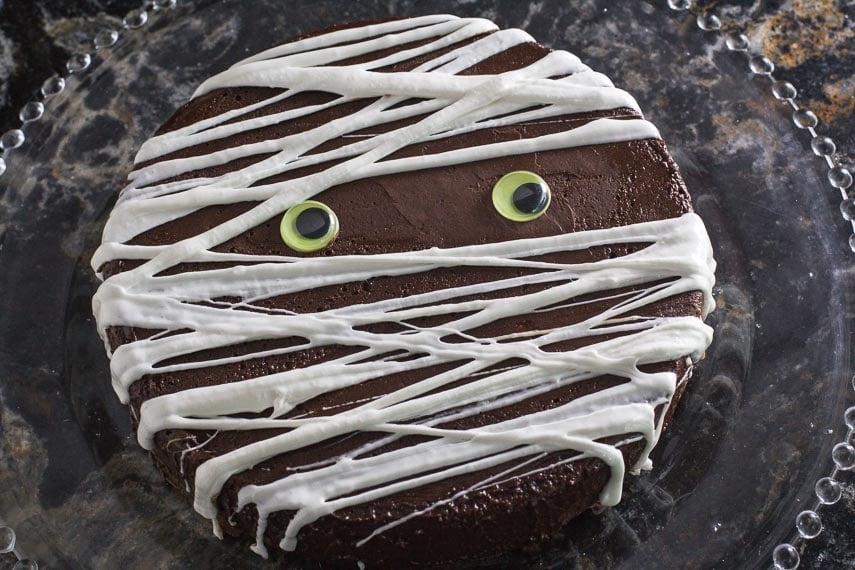 mummy decoration on low FODMAP 3 Ingredient flourless chocolate cake