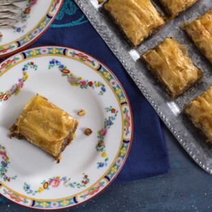 overhead image of low FODMAP walnut baklava on decorative plate and also on serving platter