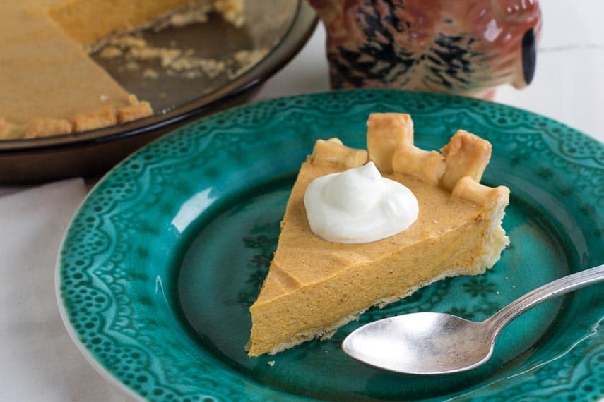 overhead view of low FODMAP pumpkin chiffon pie on a green plate