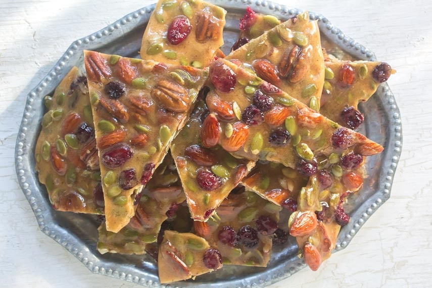 Spiced Fruit & Nut brittle piled onto a silver tray