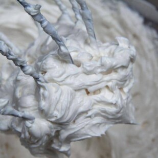 closeup of Italian meringue Buttercream on beater