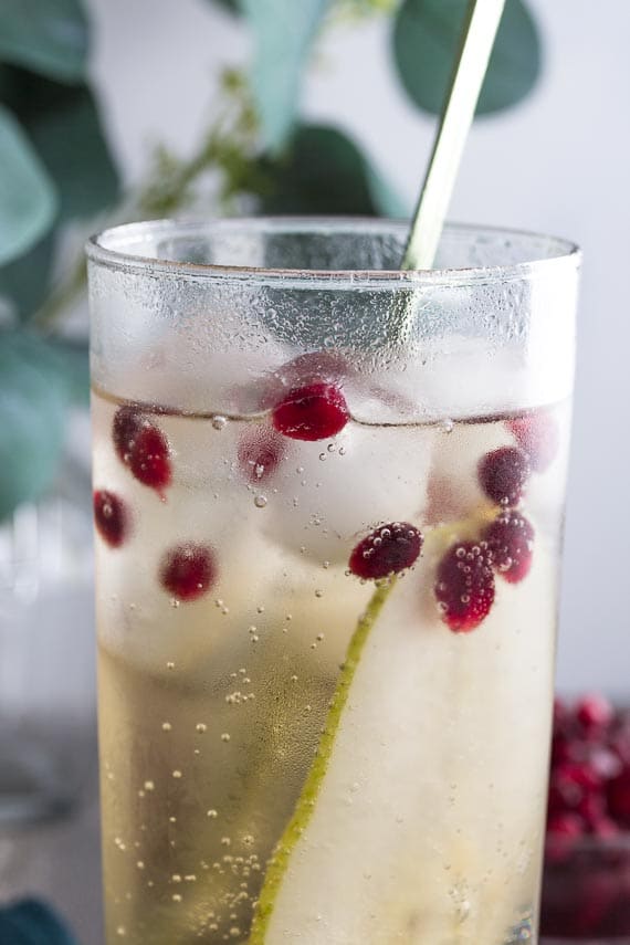 closeup of ginger pomegranate pear sparkler in a tall clear glass