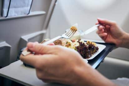 eating on plane. chalabala via 123rf