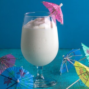 frosty low fodmap pina colada with paper parasols