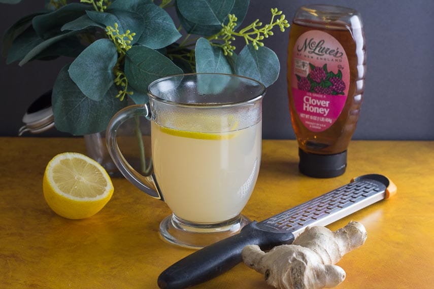 low FODMAP honey lemon ginger tea in a glass mug
