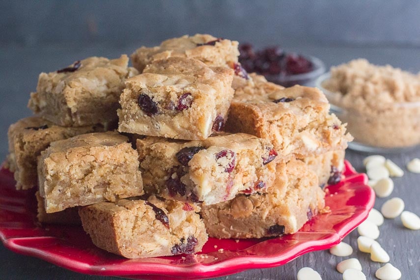 low FODMAP Cranberry white chocolate blondies on red plate-2