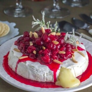 low fodmap baked brie with cranberries; cheese oozing