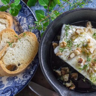 overhead image of low FODMAP Baked Feta with Honey, Walnuts & herbs