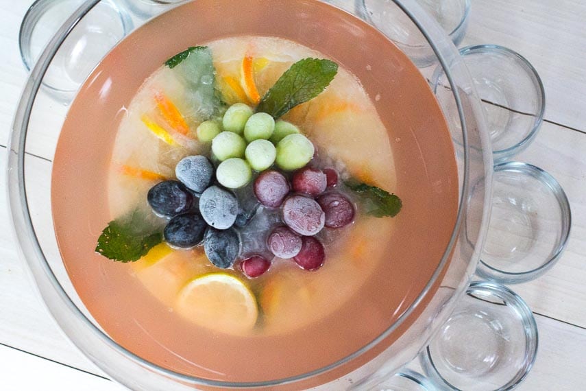 overhead image of punch bowl filled with Low FODMAP Fruited Lemonade Rosé Punch