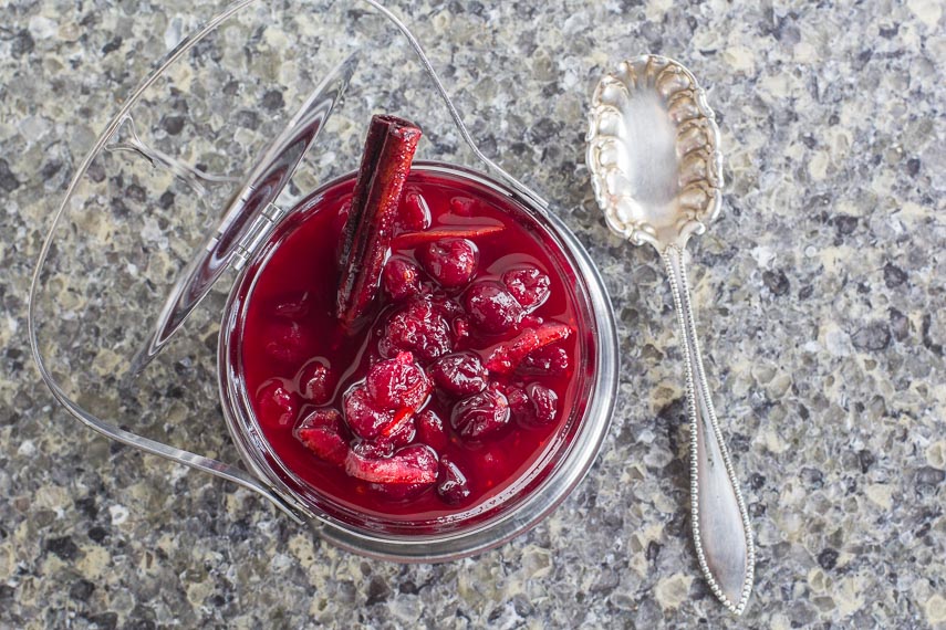 overhead view of Low FODMAP Cranberry Sauce with Orange Marmalade with silver spoon alongside