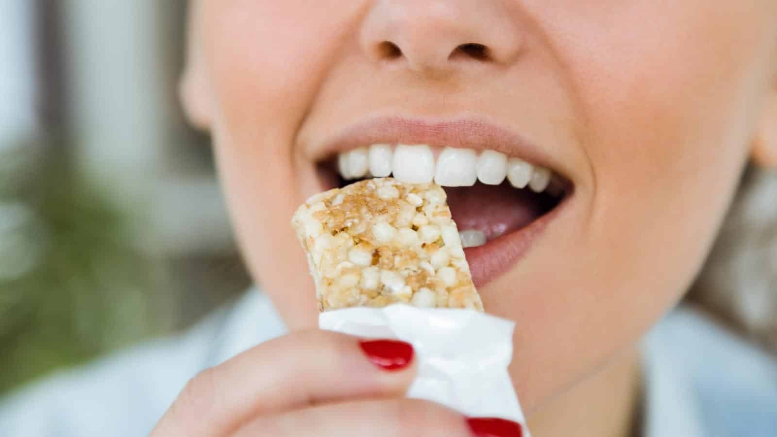 woman eating snack bar. nenetus via 123rf