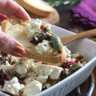 Baked Feta with Olives and sundried tomatoes on a baguette