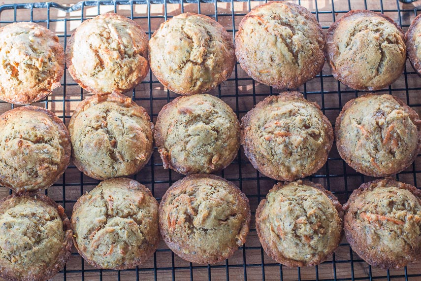 Low FODMAP Banana Carrot Chia Corn Muffins, on cooling rack in sunlight