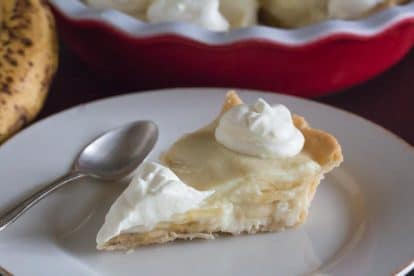 closeup of slice of low FODMAP banana cream pie on white plate