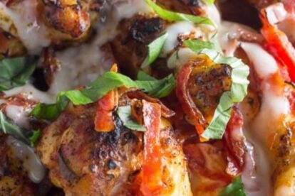 low FODMAP pizza chicken wings closeup on white oval plate