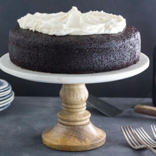 low FODMAP Black Velvet Chocolate Guinness cake with Whiskey Frosting on rustic pedestal