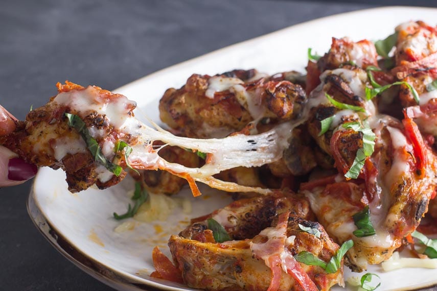 low FODMAP pizza chicken wings, cheese pull