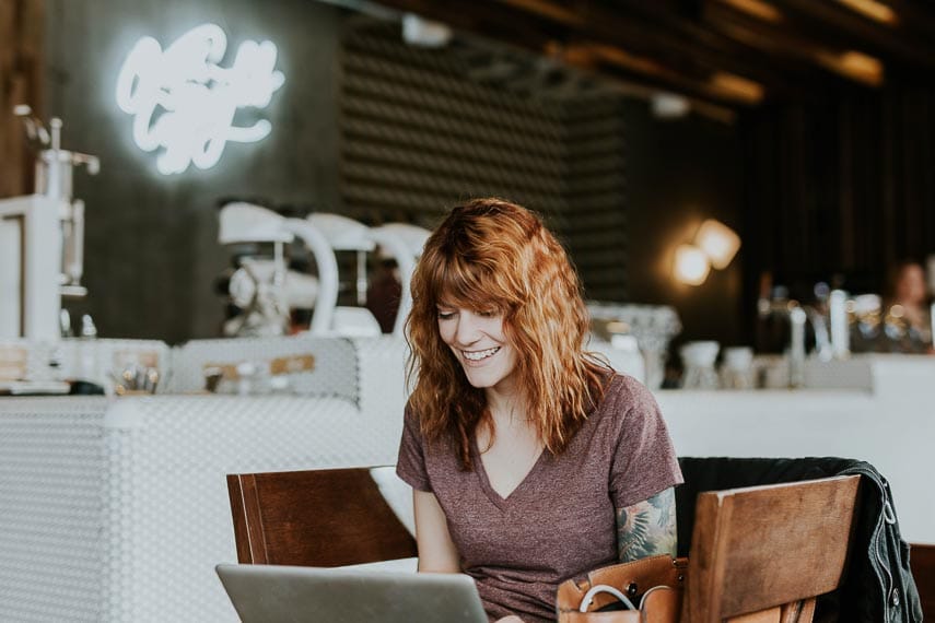 Navigating the low FODMAP diet using social media. red head woman looking at computer