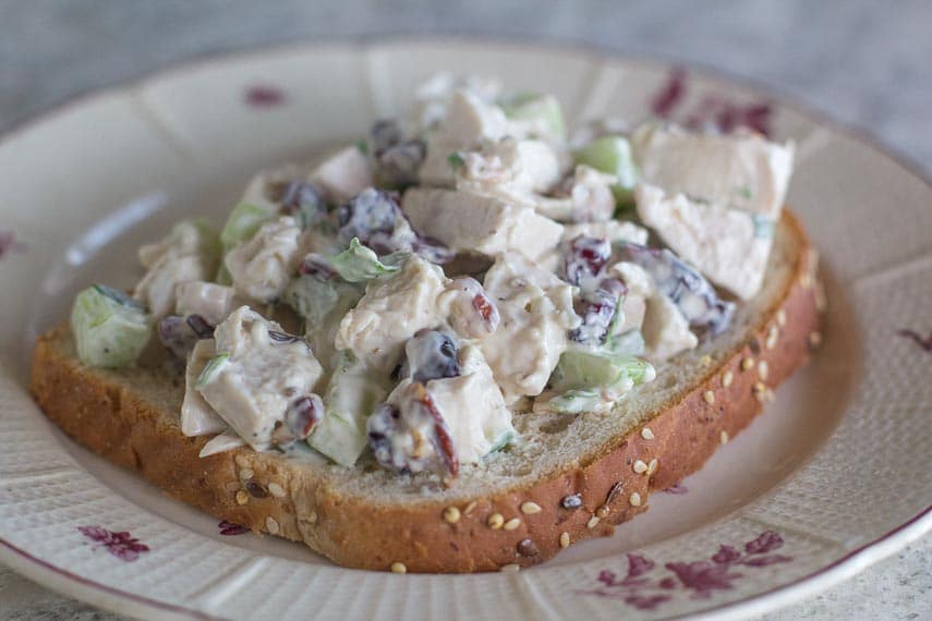 low FODMAP chicken salad with cranberries and pecans on a slice of bread