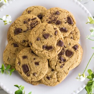 Low FODMAP Chewy Peanut Butter Chocolate Chunk Cookies on white plate; overhead image