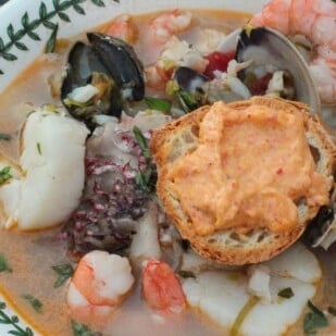 low FODMAP Bouillabaisse closeup in a shallow bowl