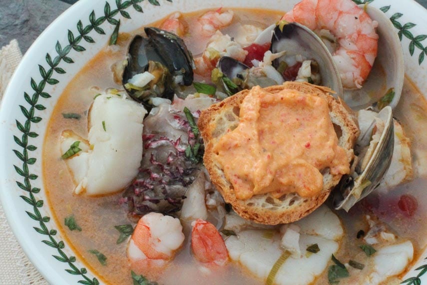 low FODMAP Bouillabaisse closeup in a shallow bowl