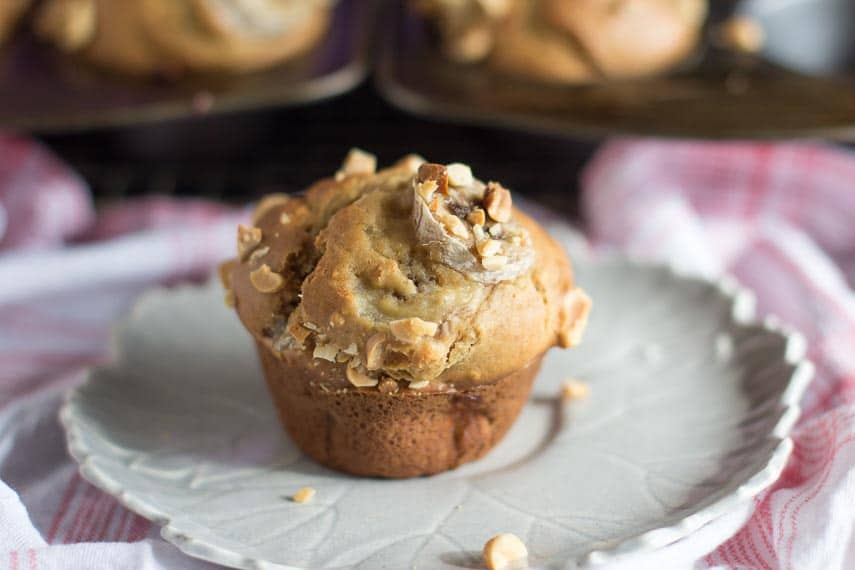 low FODMAP Peanut Butter Banana Muffins on a gray plate