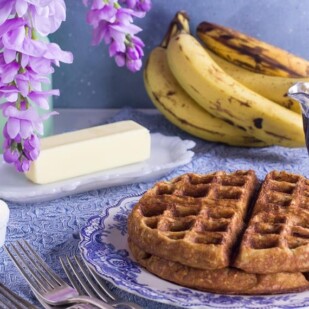 low FODMAP banana oat waffles against blue backdrop