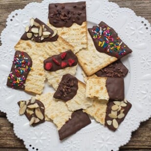 overhead low FODMAP Chocolate covered matzo on a white plate