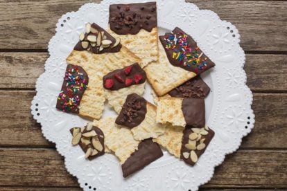 overhead low FODMAP Chocolate covered matzo on a white plate
