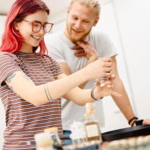 couple cooking in kitchen. vadymvdrobot via 123rf
