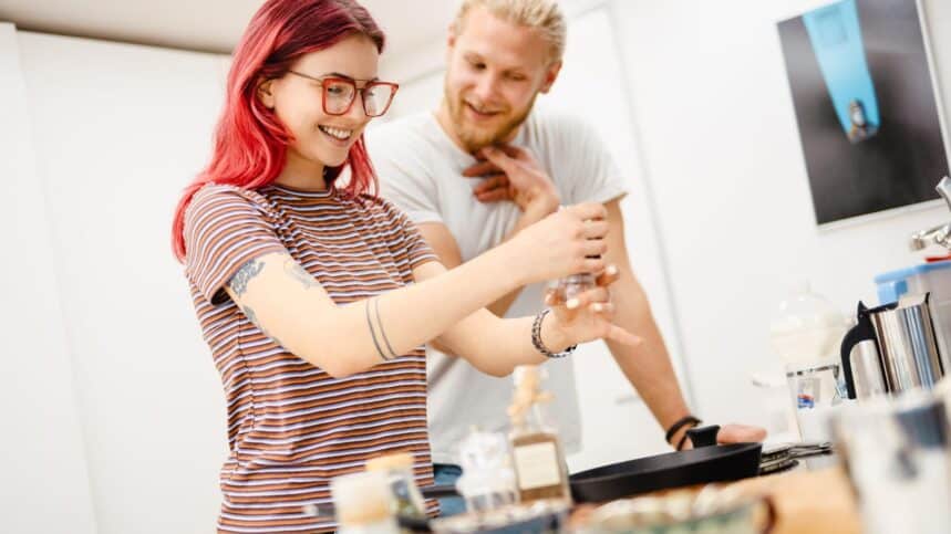 couple cooking in kitchen. vadymvdrobot via 123rf