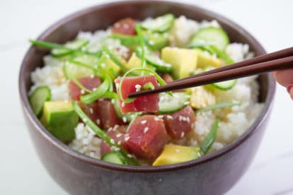 closeup of low FODMAP tuna poke in brown bowl with chopsticks