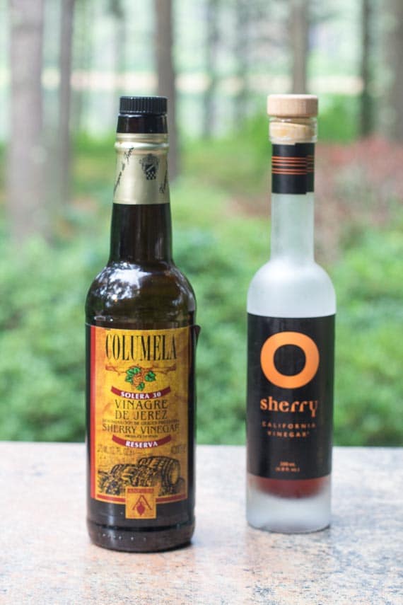 Columela imported sherry vinegar and O Sherry Vinegar from California; bottles on a stone surface outdoors