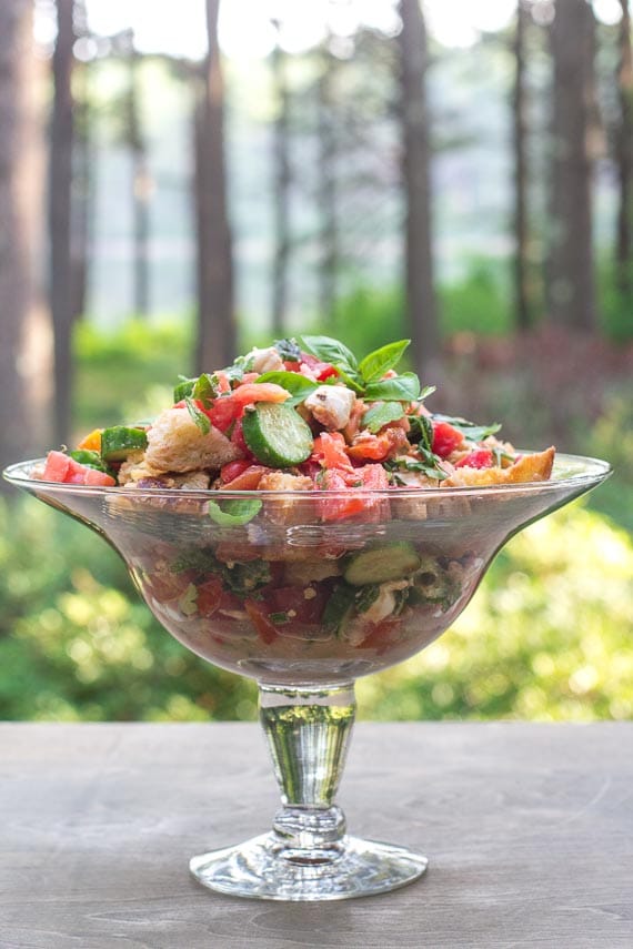 Low FODMAP Panzanella with Tomatoes, Cucumbers & basil in a glass pedestal dish