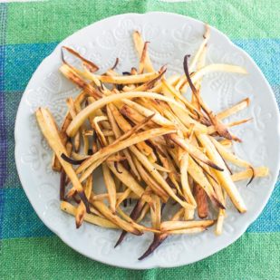 overhead of low FODMAP parsnip fries on aqua cloth