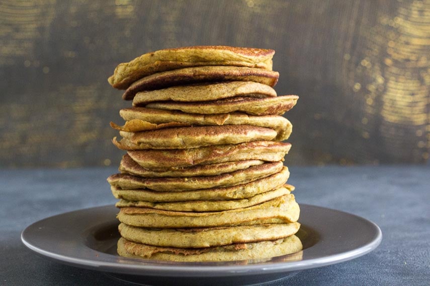 Low FODMAP Buckwheat Banana Pancakes on gray plate and gray surface