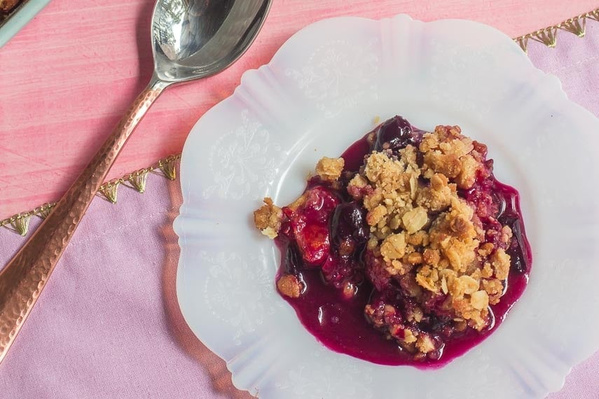 closeup of Low FODMAP Cranberry Crisp with Grapes & Citrus on plate